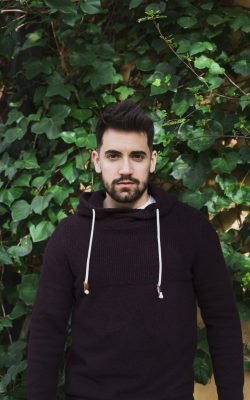 man-standing-near-green-leaves